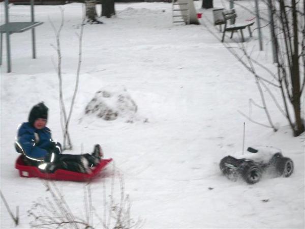 Traxxas E-Maxx 3906 pulling my kid
