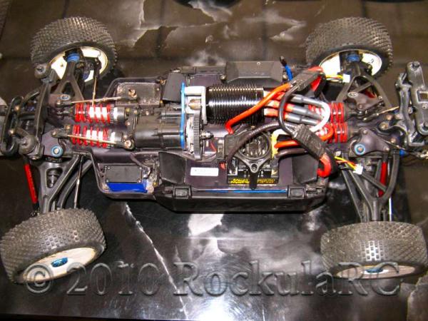 MMM, 2x 2s Turnigy 5000mah 40C lipos, Single Steering, TRX sway bars, Alum rods, stock Slayer Pro links, Extended Slayer Pro arms, E-Revo chassis dyed black. Pro Line rims. A very nice driver!